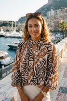 TWISTED HIGHNECK ANIMAL PRINT BLOUSE